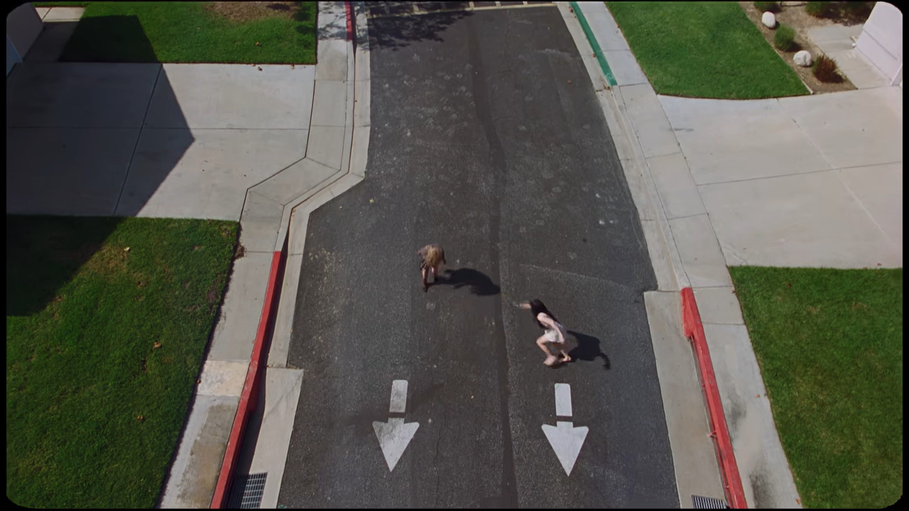 A still from Disease by Lady Gaga where she is being chased by her doppelganger.