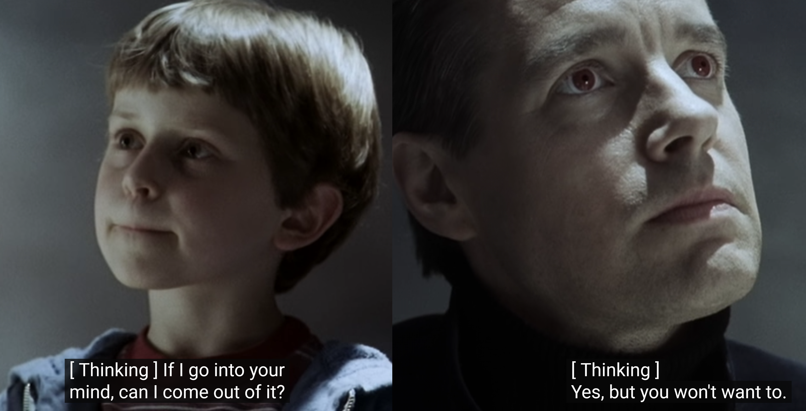 A still from A Wrinkle In Time. Charles Wallace is on the left, thinking "If I go into your mind, can I come out of it?" The Man With Red Eyes is on the right, thinking "Yes, but you won't want to."