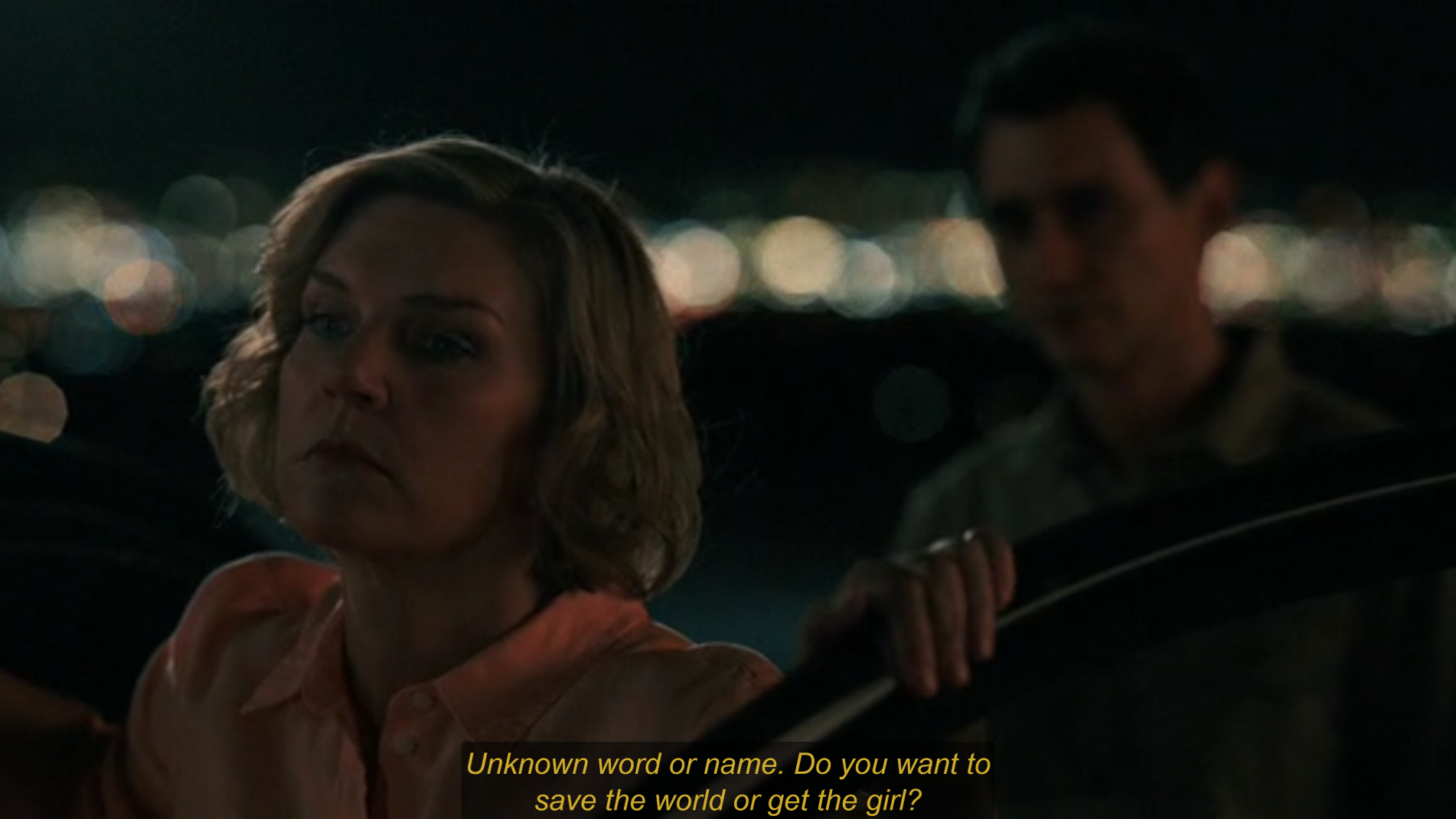 Carol and Manousos. An automatic translation is saying "Unknown word or name. Do you want to save the world or get the girl?"